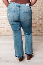 Load image into Gallery viewer, Isla Mid Rise Distressed Released Hem Bootcut Jeans